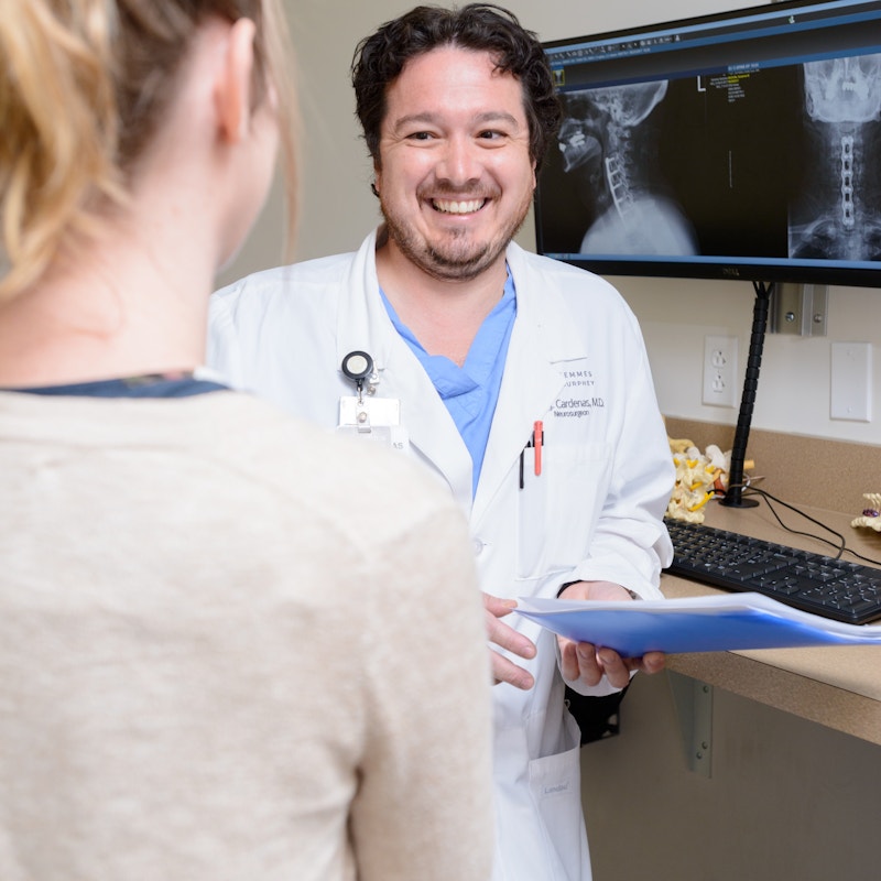 Dr. Cardenas Smiling to a Patient at Semmes Murphey Clinic