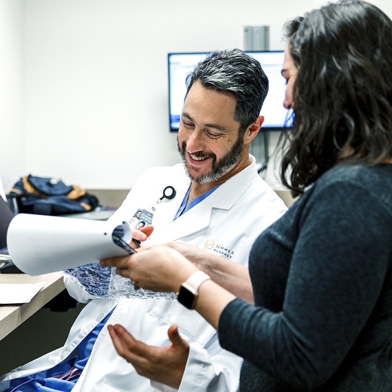 Doctor Elijovich looks over paper with nurse 0021