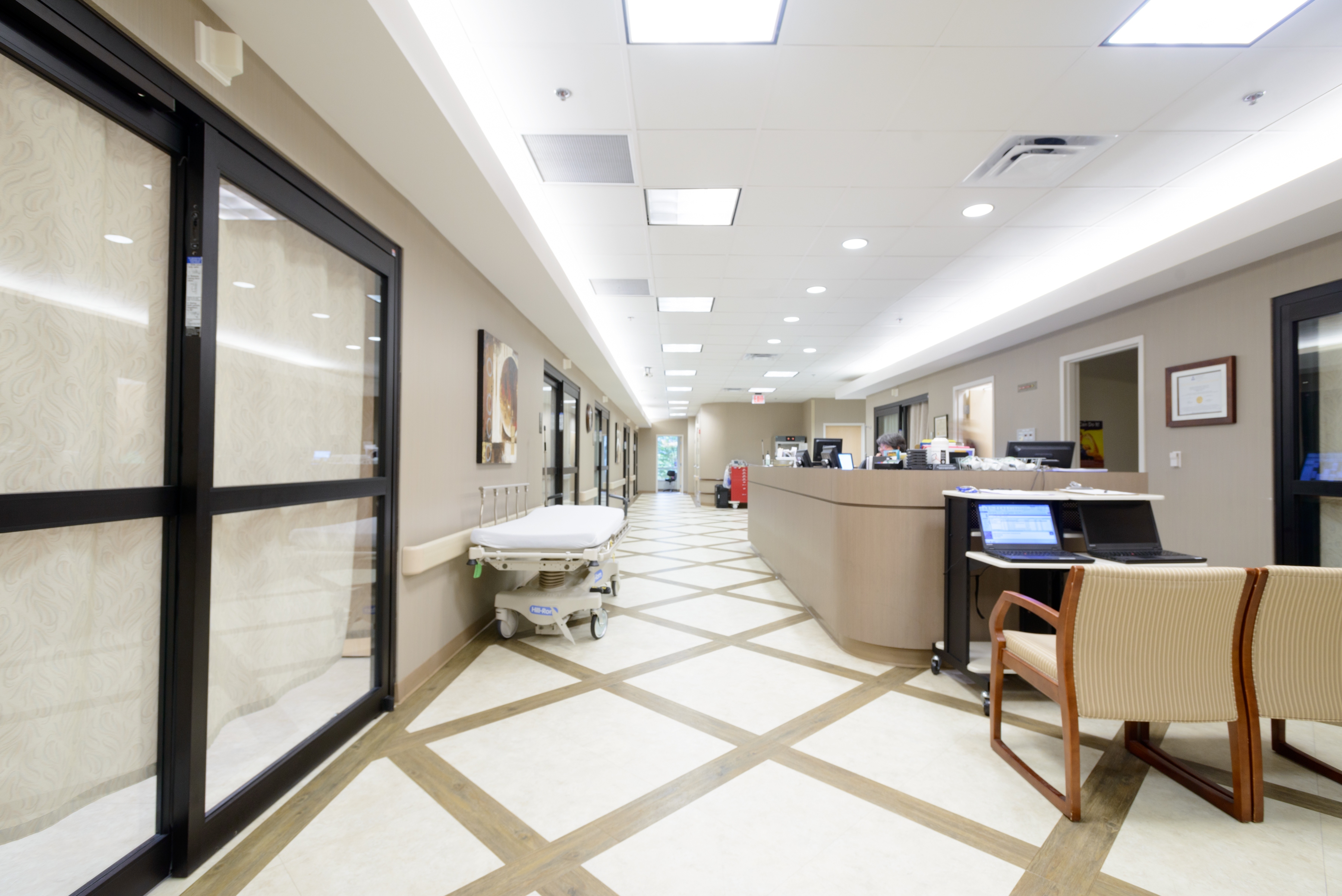 Interior of the surgery center, with a check in desk and chairs