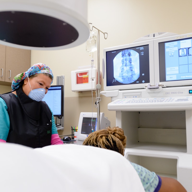 Nurse with Patient Before a Pain Block - Semmes Murphey Clinic